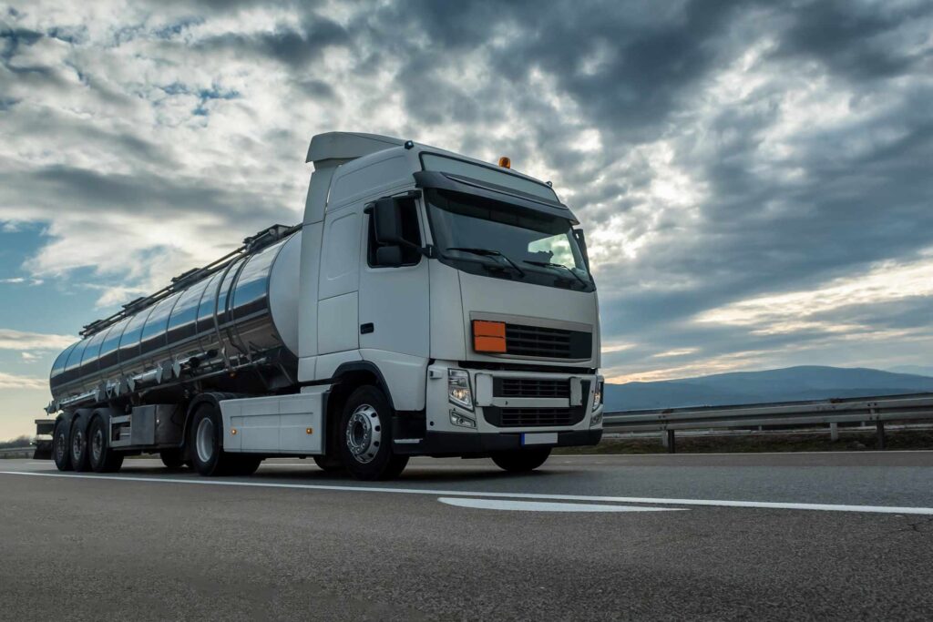 Tanker truck traveling on Texas highway, illustrating driverless trucks in Texas.