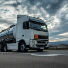 Tanker truck traveling on Texas highway, illustrating driverless trucks in Texas.